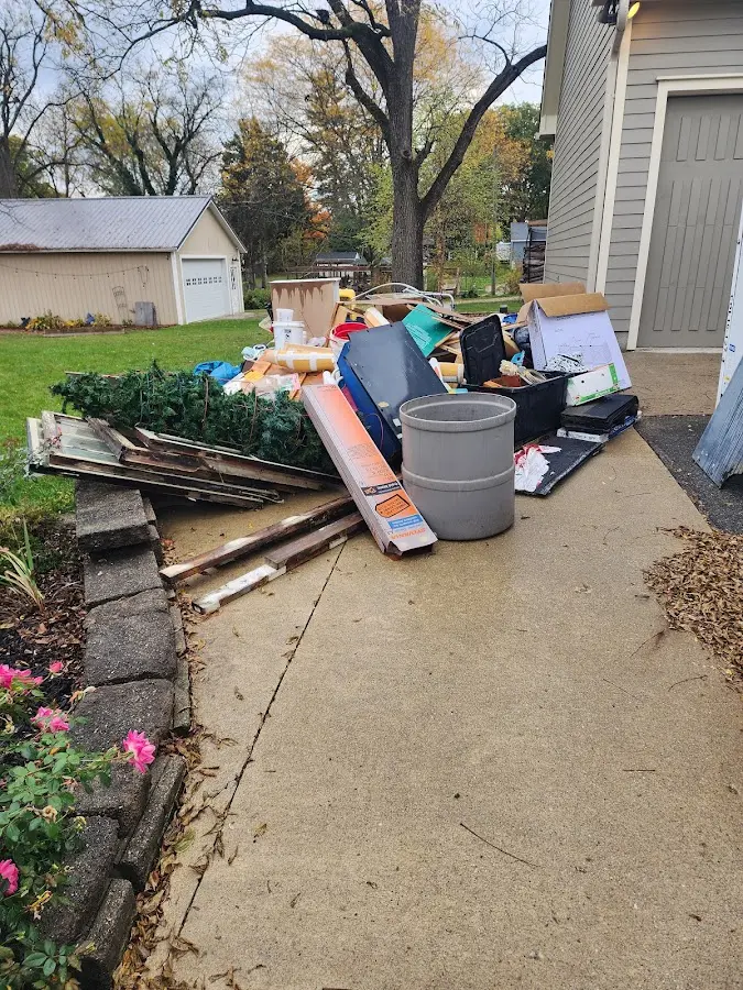 Dumpster being loaded with debris for Residential Dumpster Rental in Upper Frederick